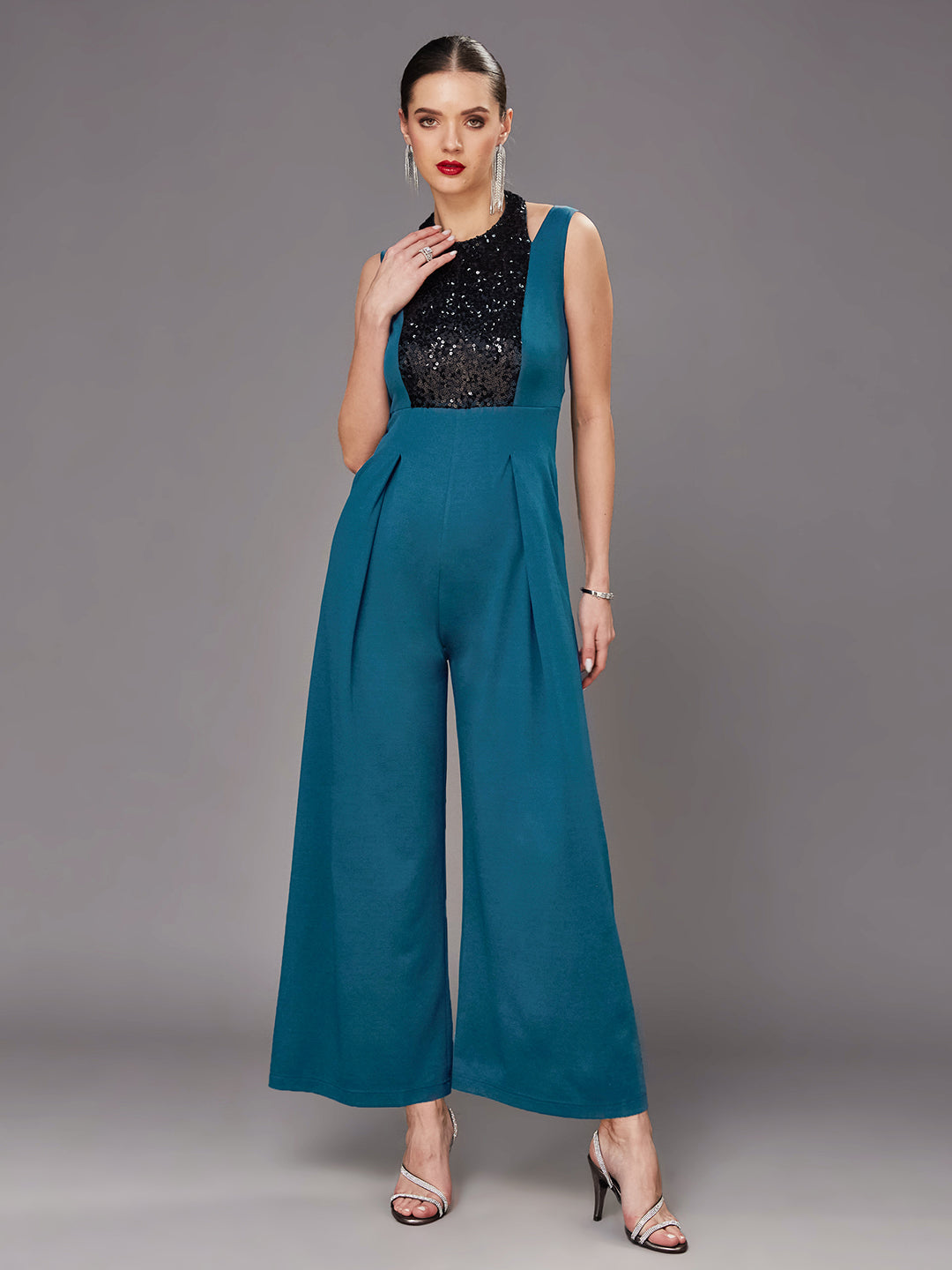 Teal Color Halter Neck Sleeveless Solid Pleated/Wide Leg Sequin Paneled Regular Length Jumpsuit for Women