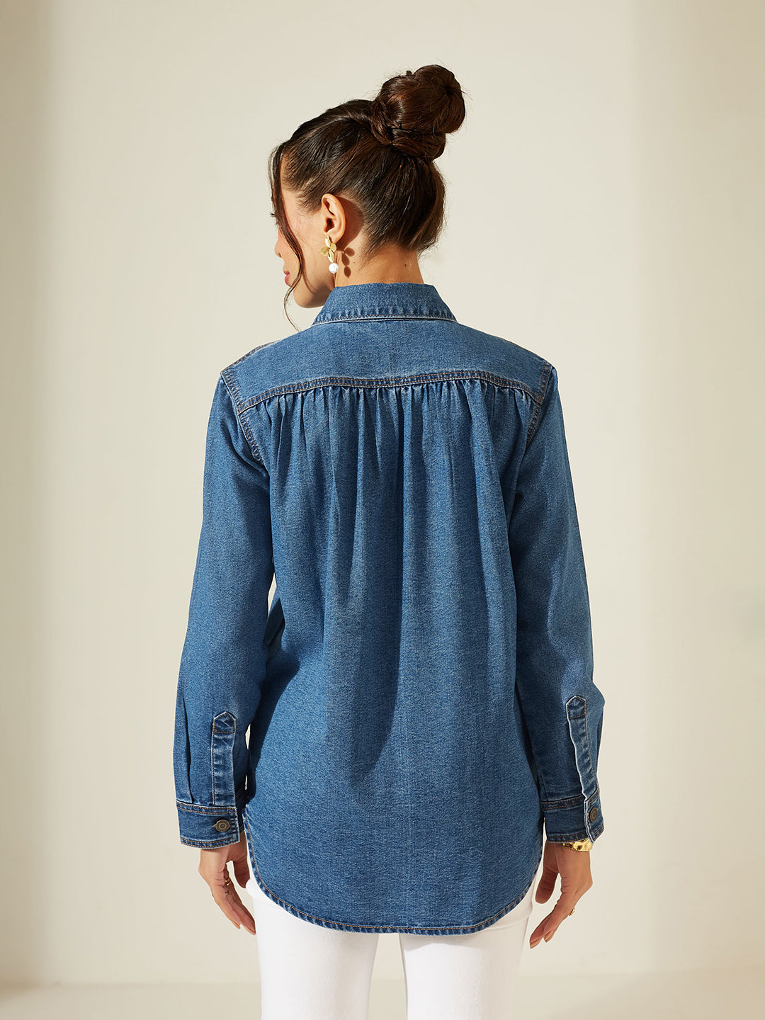 Woman wearing a blue denim shirt