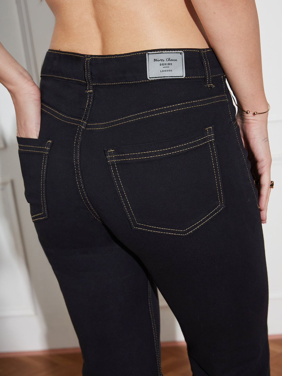 Women's Black Bootcut High-Rise Clean-Look Regular-Length Stretchable Denim Jeans
