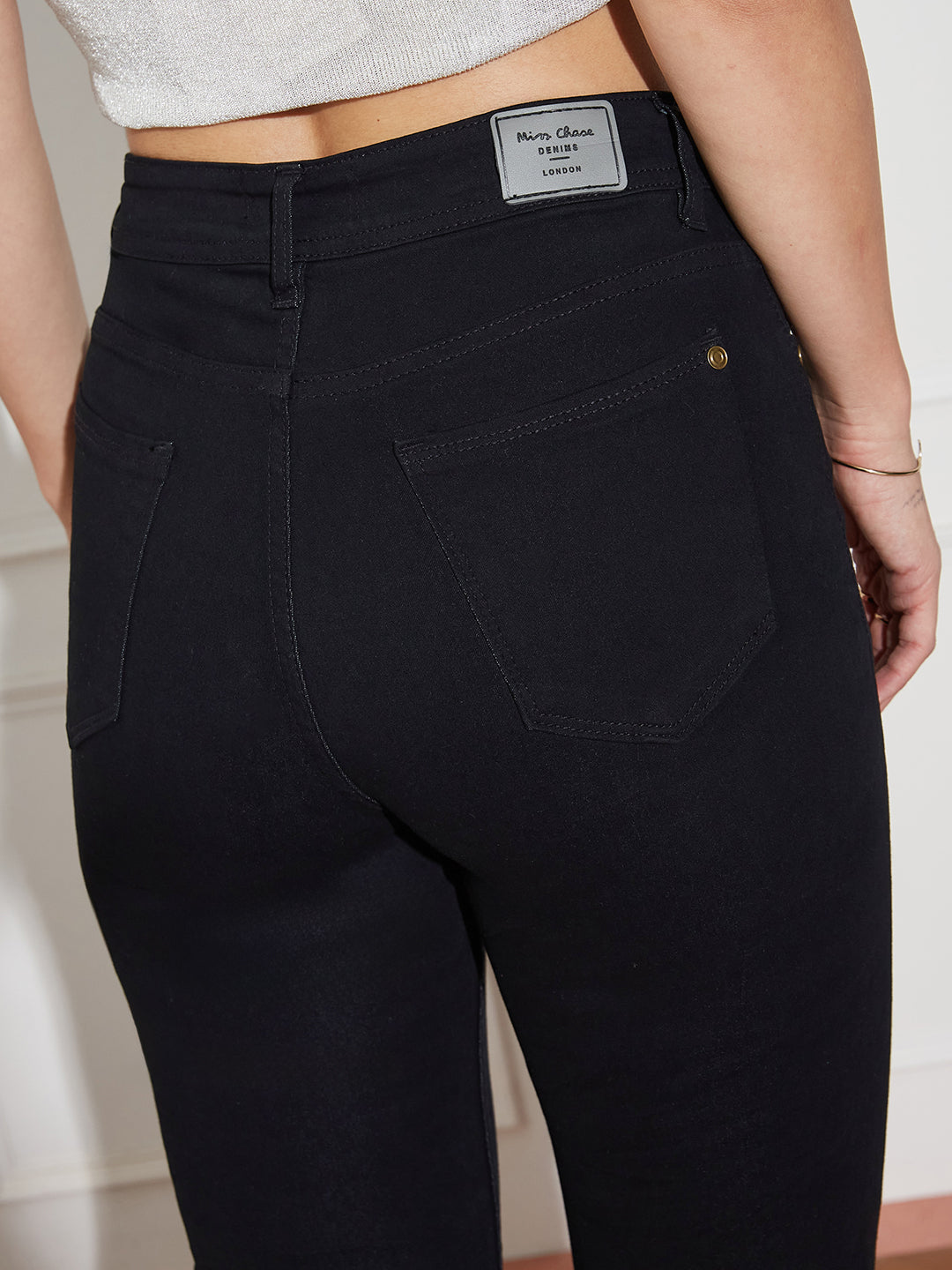Women's Black Slim Fit High Rise Regular Length Zipper And Raw Edge Detailing Stretchable Denim Jeans