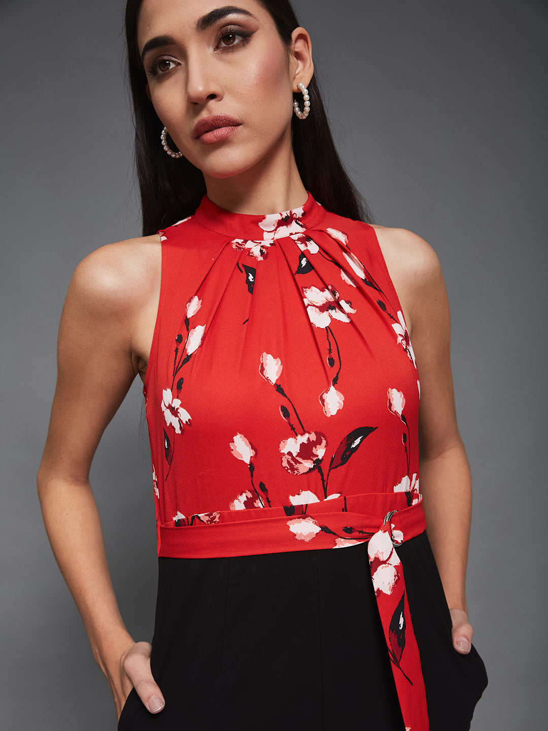 Women's Red & Black Georgette Floral Regular Halter Jumpsuit. Has floral pattern and zip closure.