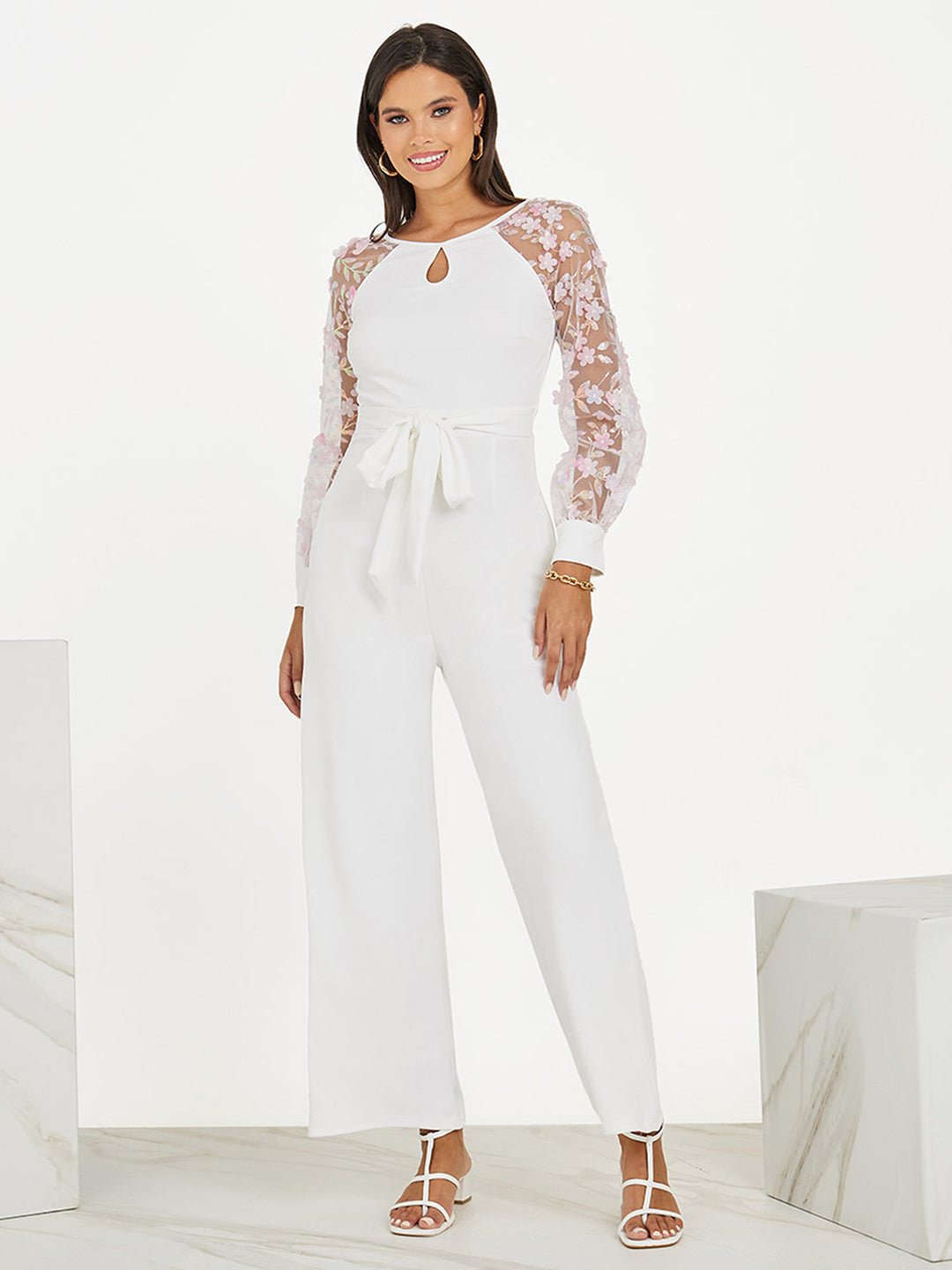 Women's Off White Floral Keyhole Neck Bishop Sleeves Side Pocketed Polyester Back Tie-Up Regular-Length Jumpsuit