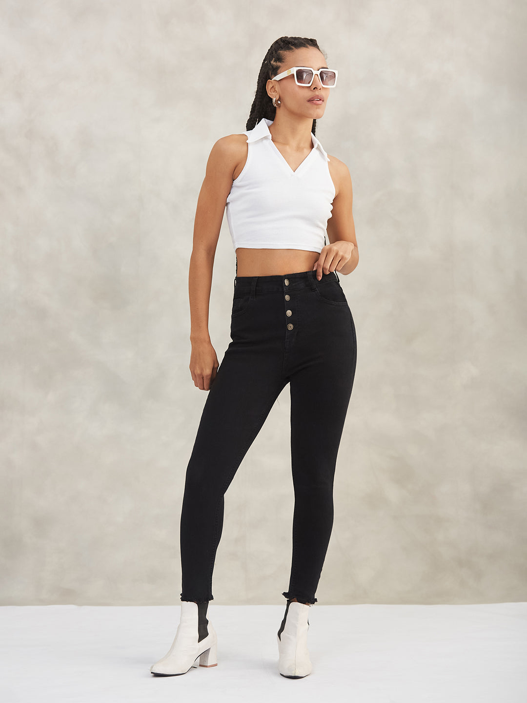 Women's Black Skinny High-Rise Cropped Fringed Hemline Solid Stretchable Denim Jeans