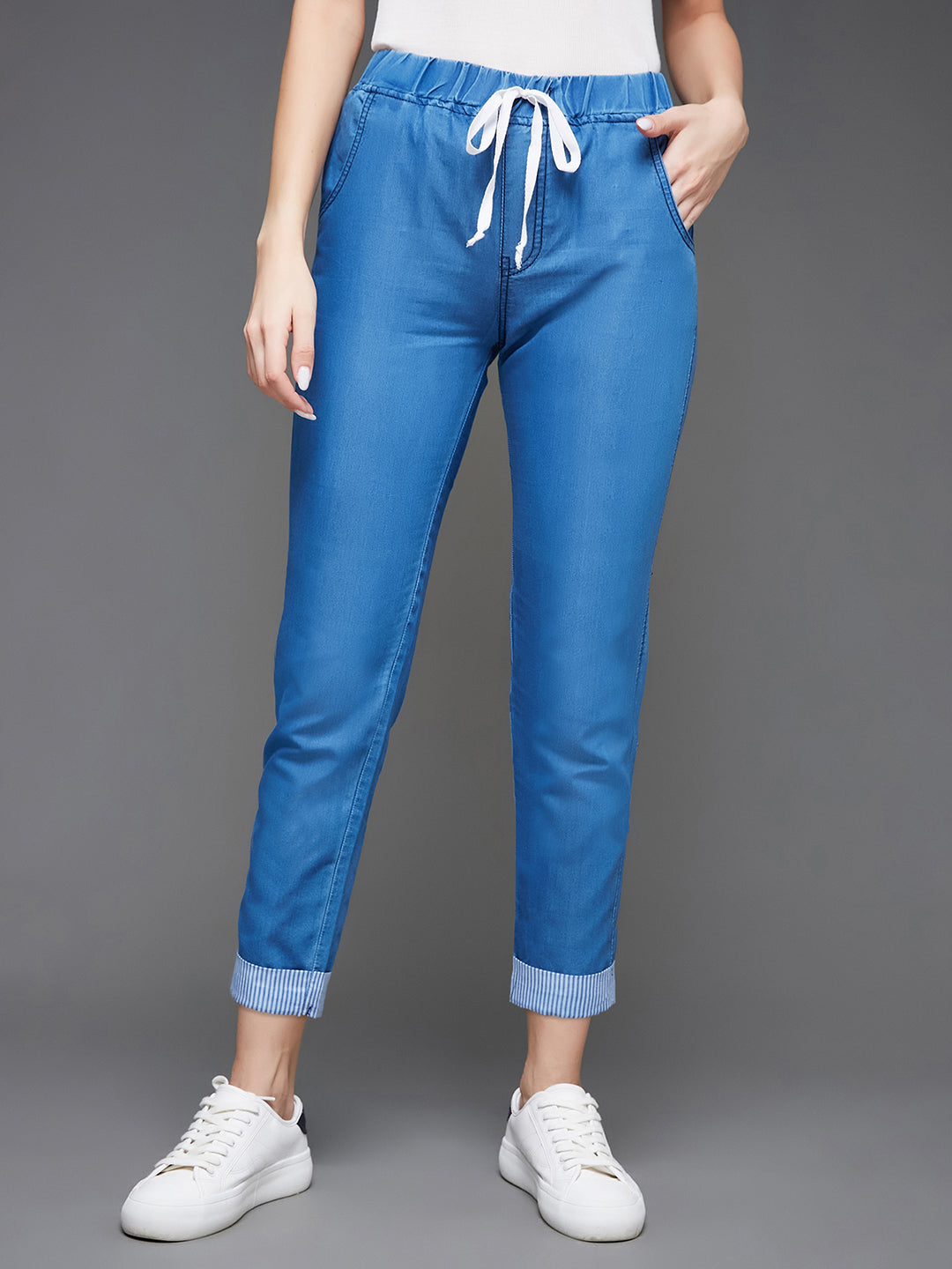 Women's Blue High Rise Clean Look Solid Cropped Striped Detailing Denim Joggers