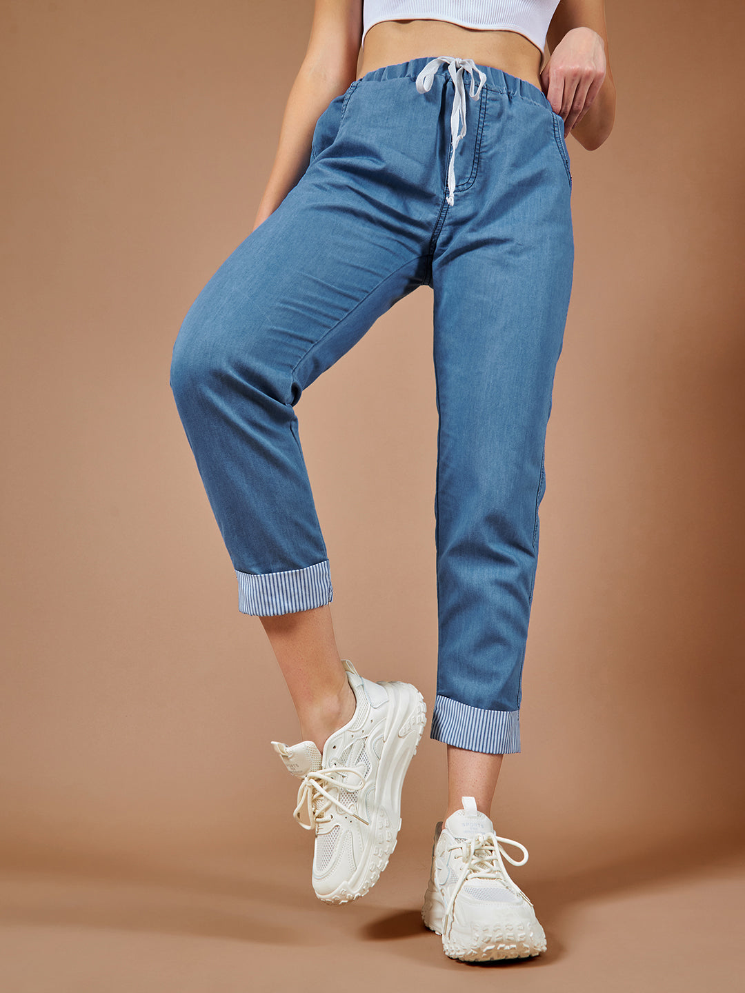 Women's Blue High Rise Clean Look Solid Cropped Striped Detailing Denim Joggers