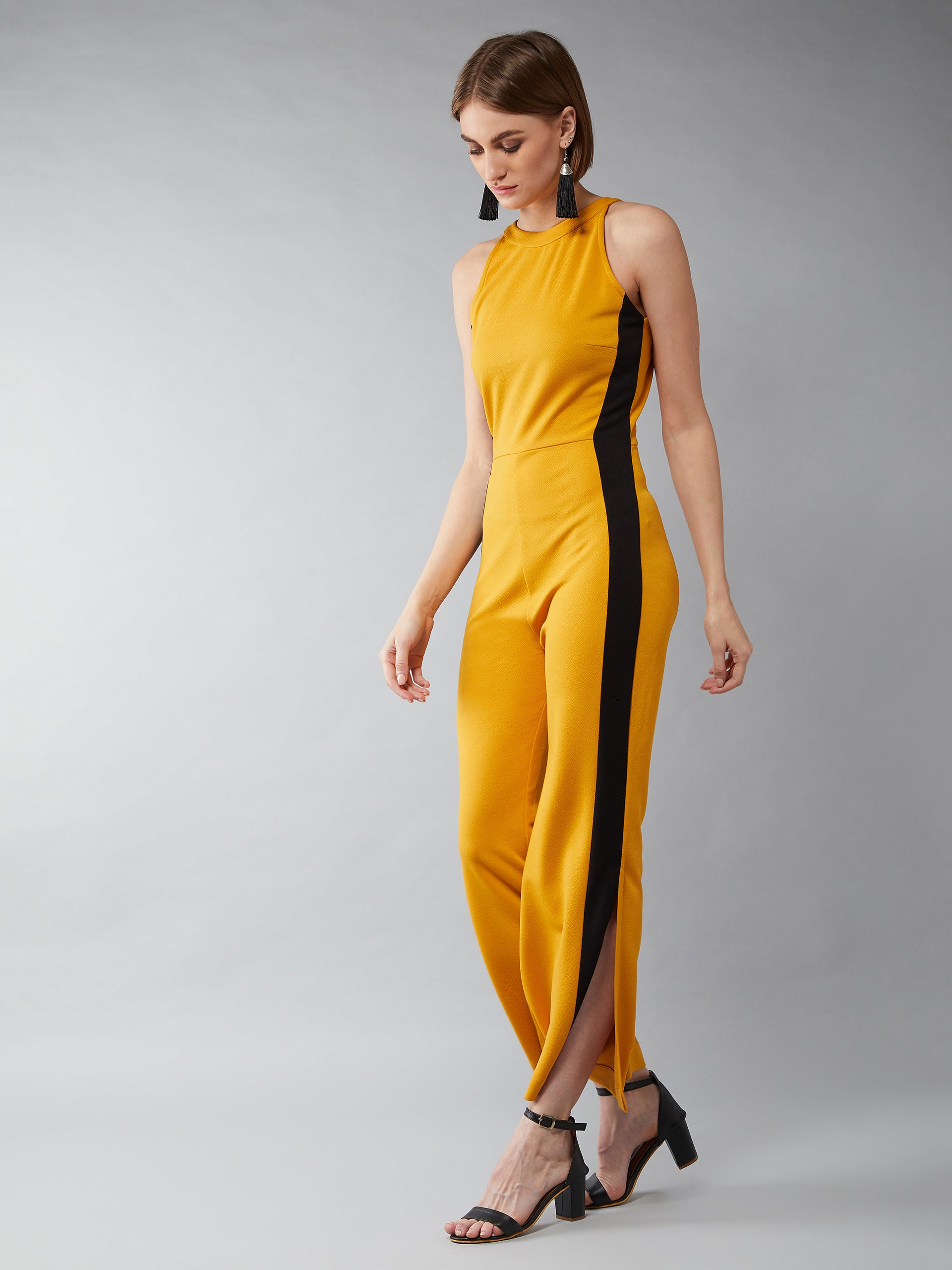 Women's Mustard Yellow & Black Halter Neck Sleeveless Solid Flared Jumpsuit