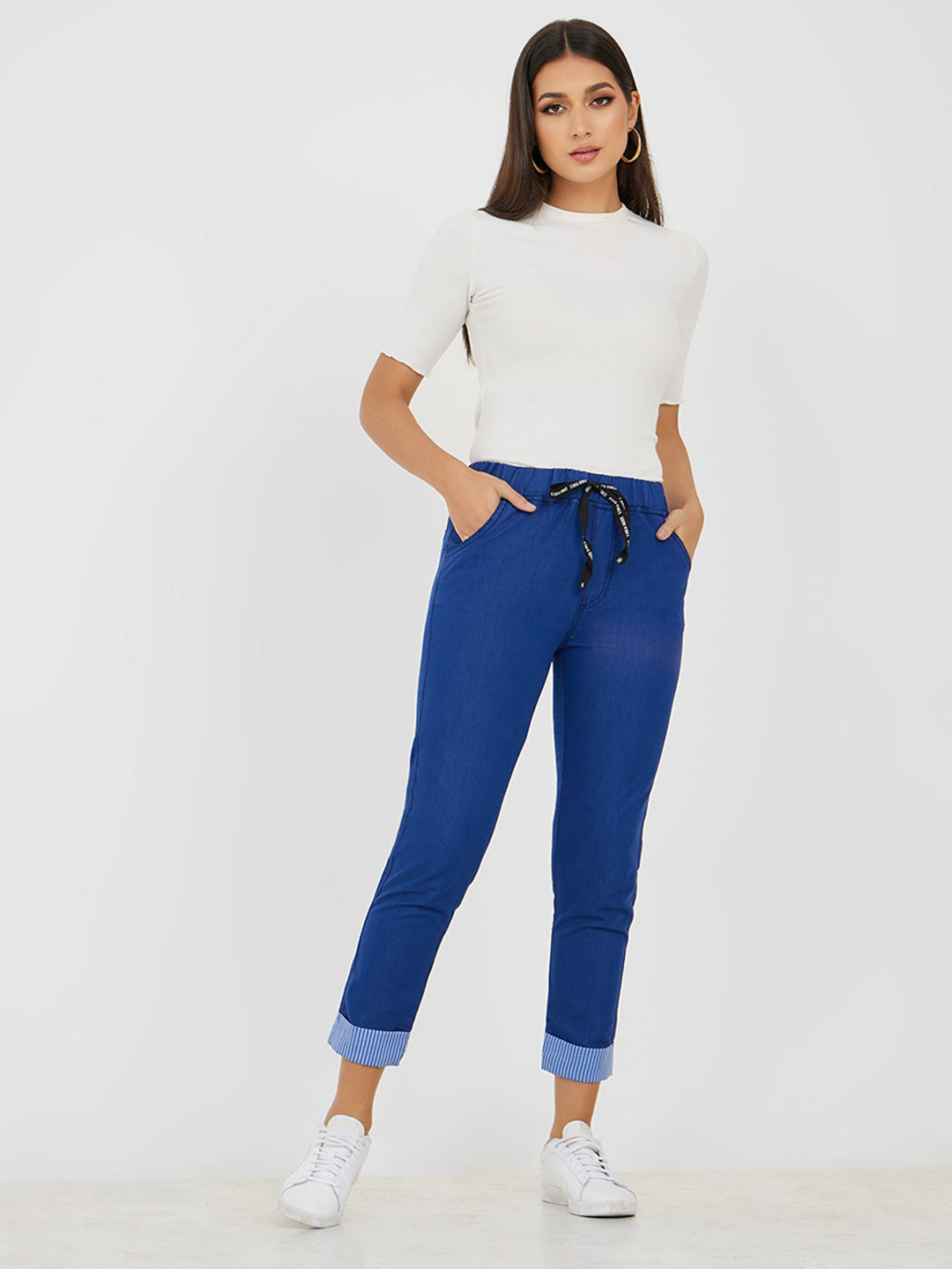 Women's Blue High Rise Clean Look Solid Cropped Striped Detailing Denim Joggers