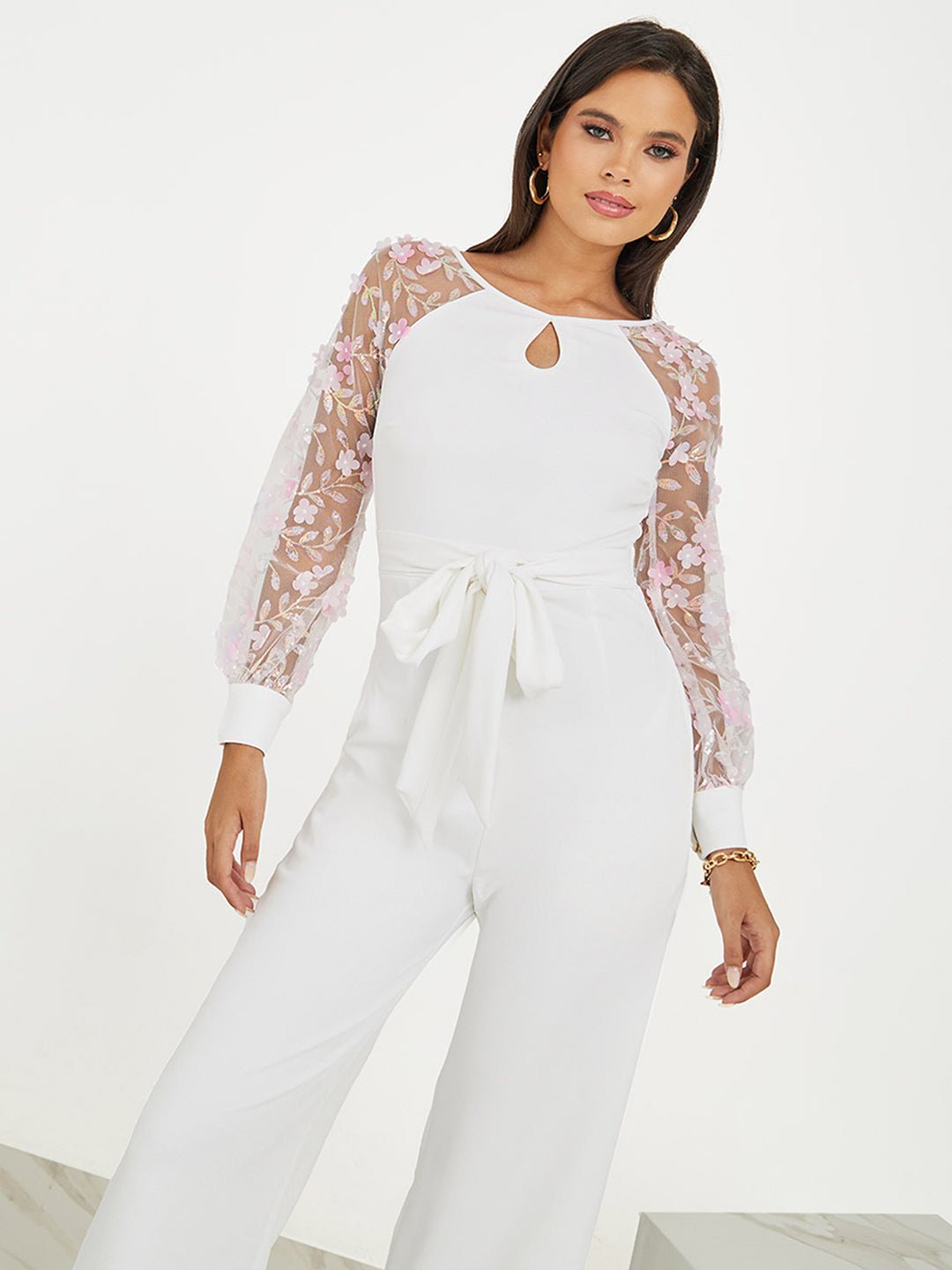 Women's Off White Floral Keyhole Neck Bishop Sleeves Side Pocketed Polyester Back Tie-Up Regular-Length Jumpsuit