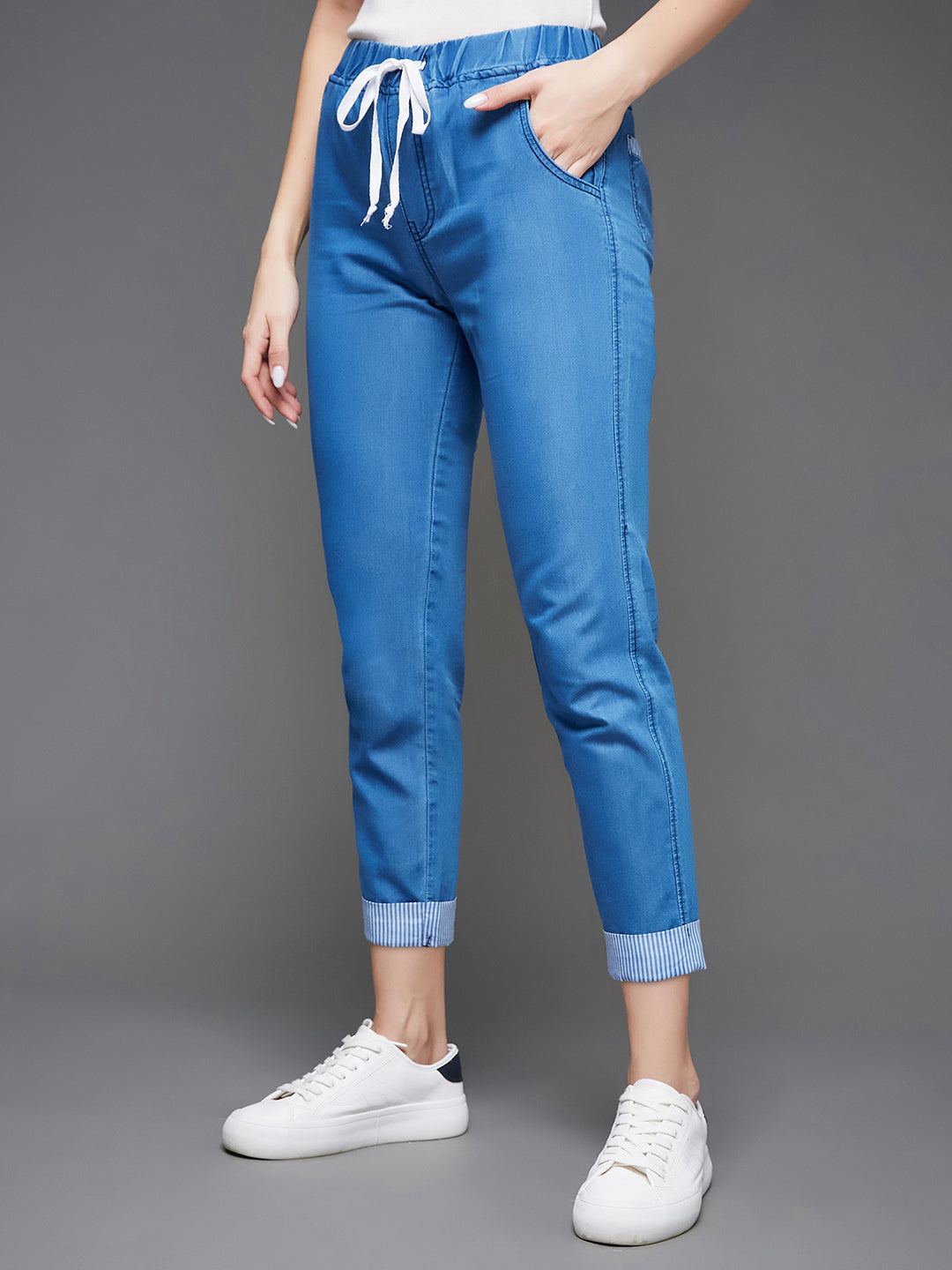 Women's Blue High Rise Clean Look Solid Cropped Striped Detailing Denim Joggers