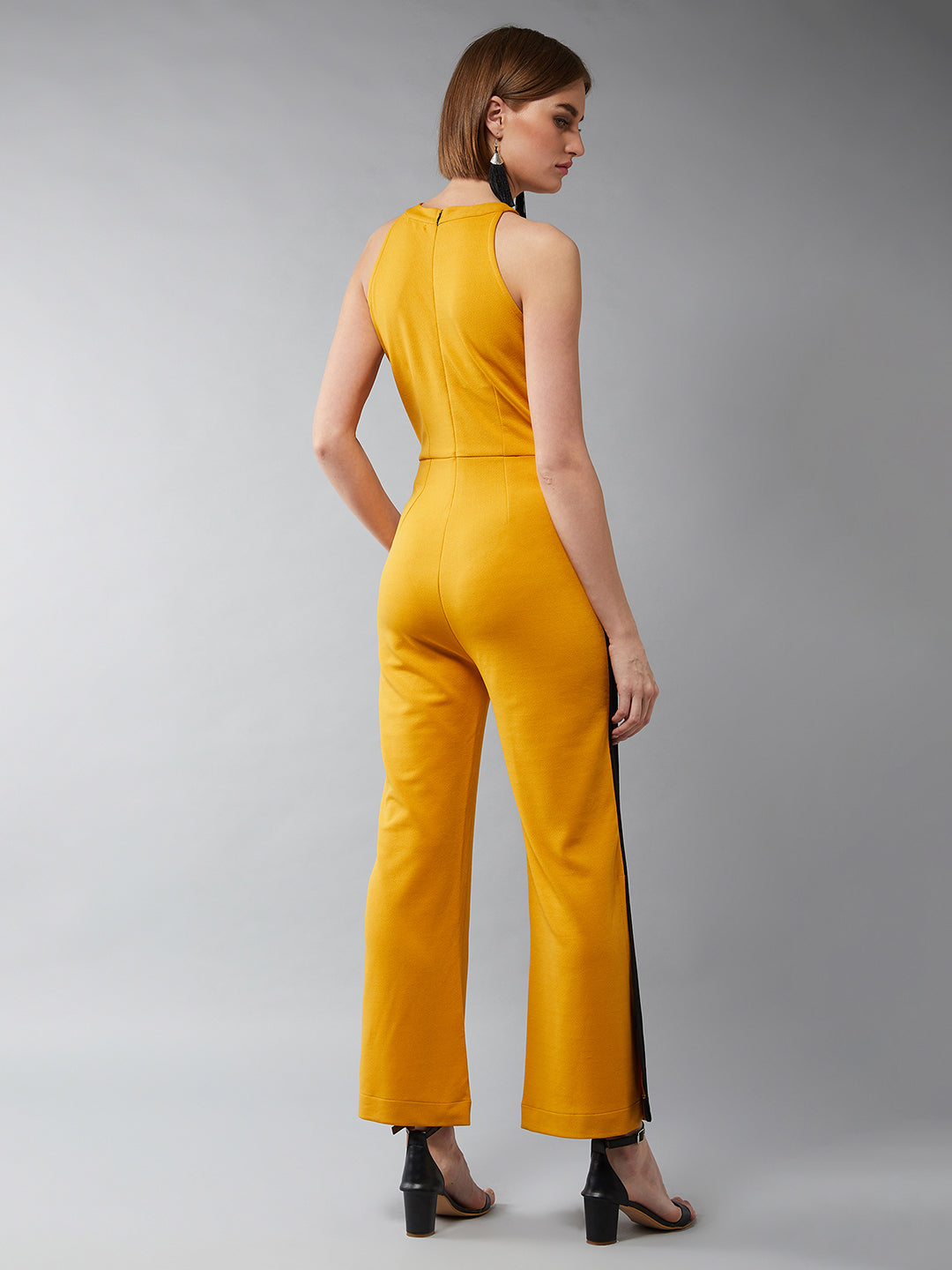 Women's Mustard Yellow & Black Halter Neck Sleeveless Solid Flared Jumpsuit