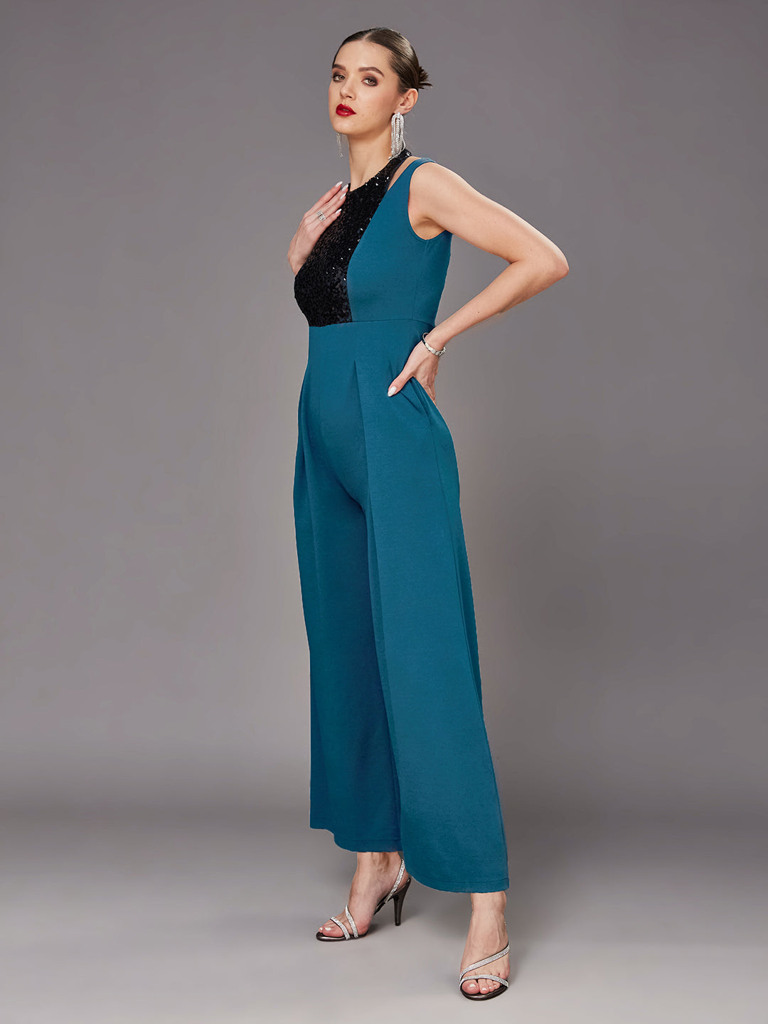 Teal Color Halter Neck Sleeveless Solid Pleated/Wide Leg Sequin Paneled Regular Length Jumpsuit for Women