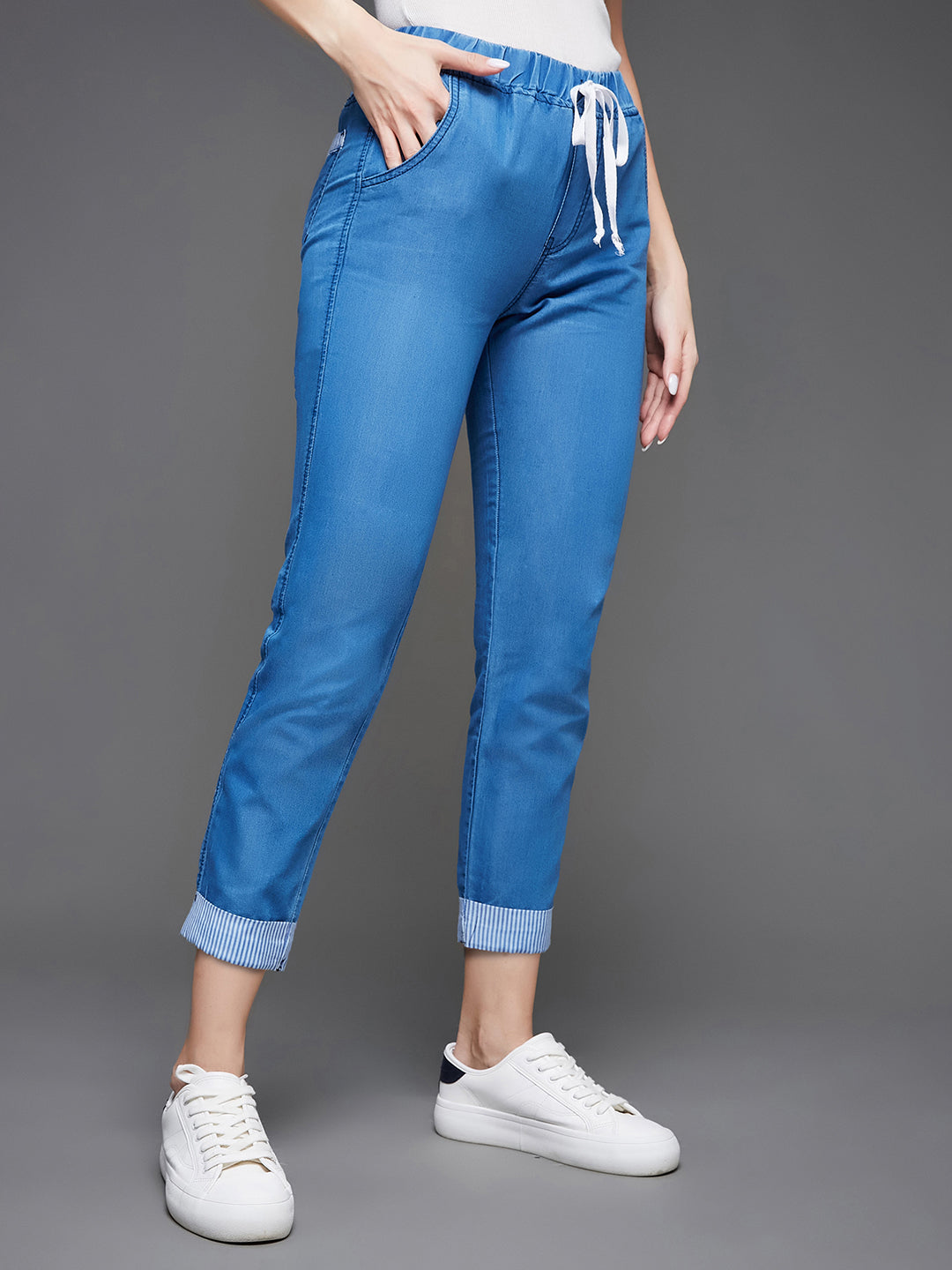 Women's Blue High Rise Clean Look Solid Cropped Striped Detailing Denim Joggers