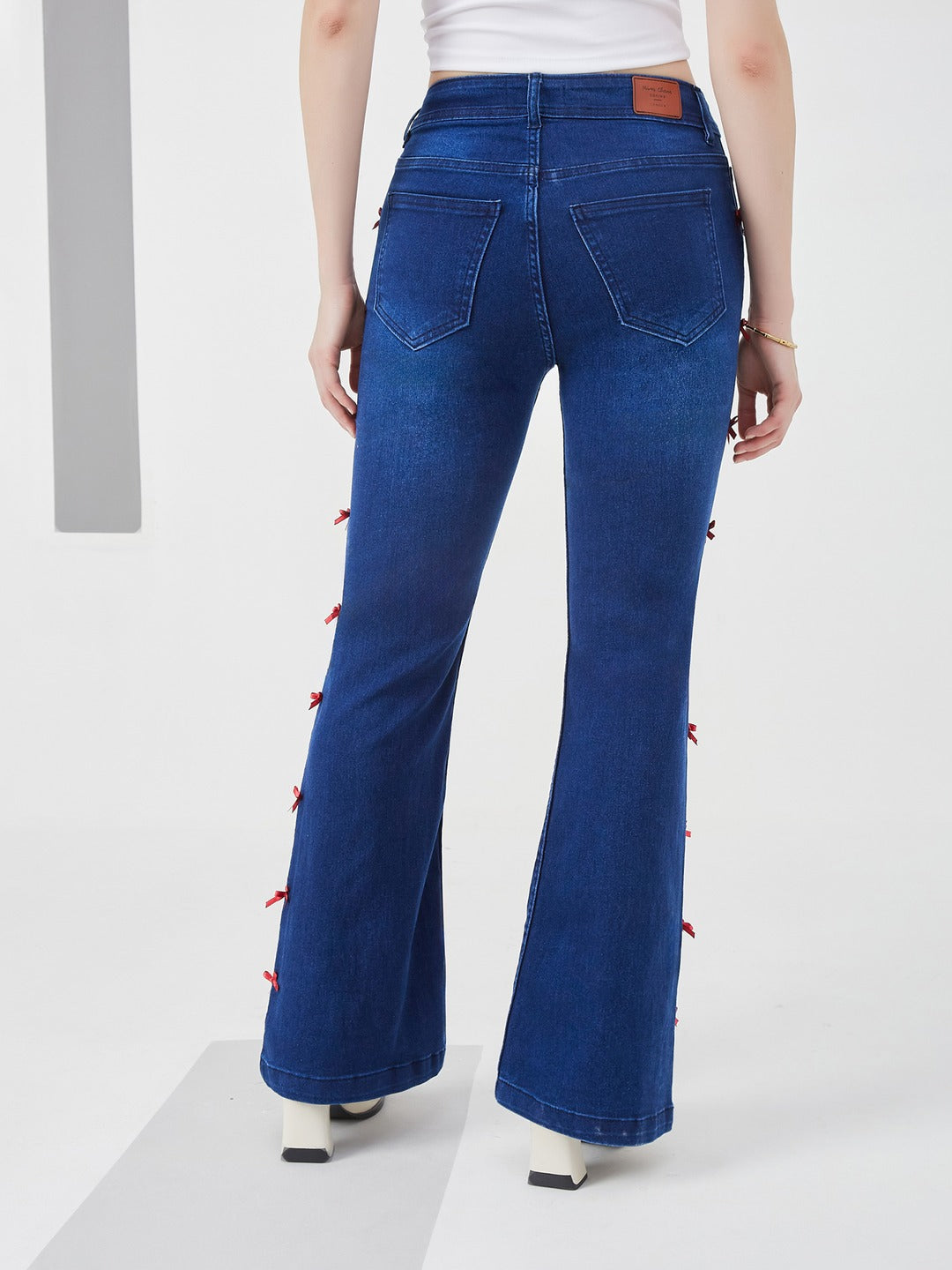 Navy Blue High-Rise dark red satin bows stitched along side seams , Stretchable Bootcut Denim Jeans for Women