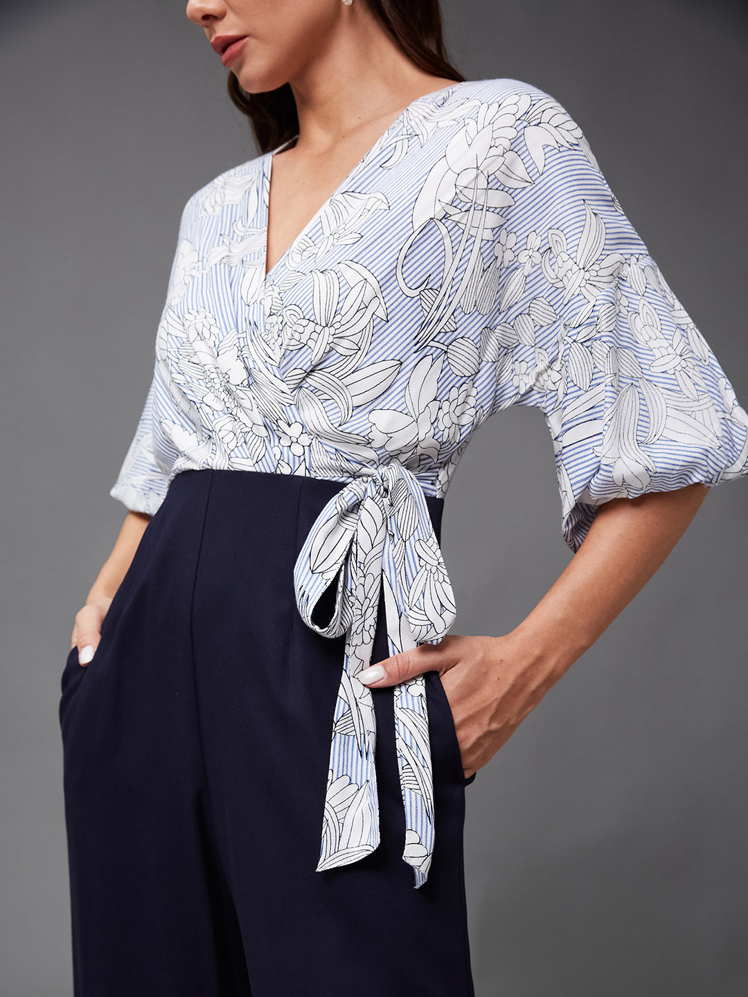 Women's Multicolored Base Navy Blue V-Neck 3/4 Sleeve Floral Wrap-Styled Jumpsuit