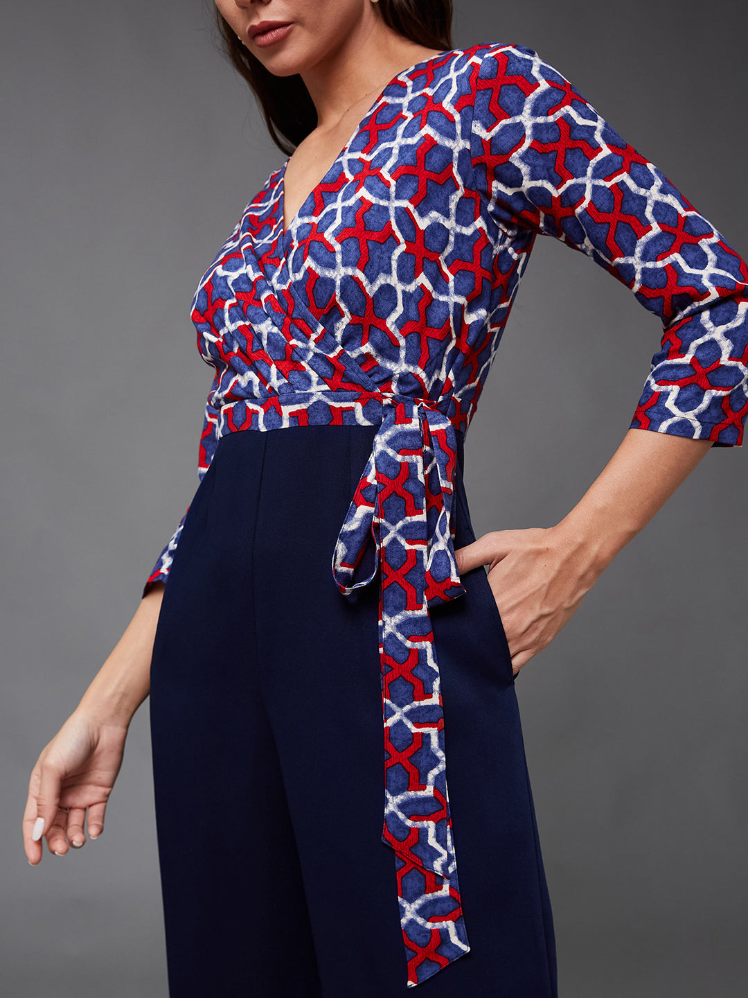 Women's Multicolored-Base-Navy Blue V-Neck Three-Quarter Sleeve Geometric Patterned Wrap Regular-Length Polyester Jumpsuit