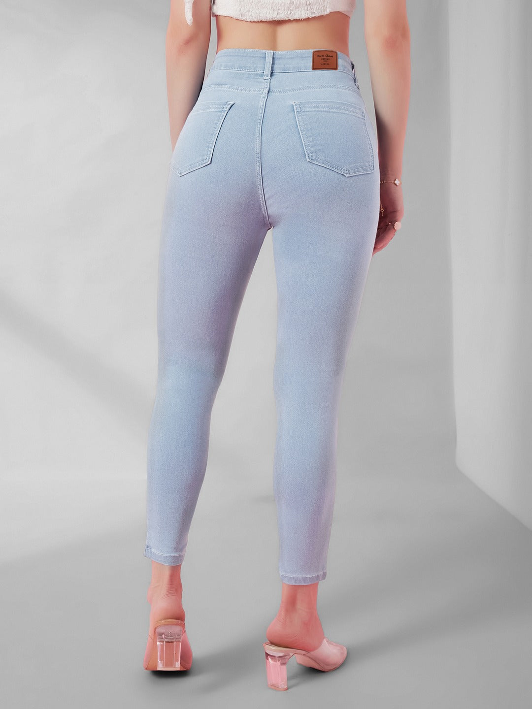 Light Blue Skinny Fringed Hemline Detailing high-rise Ice Wash Cropped Solid Stretchable Denim Jeans for Women