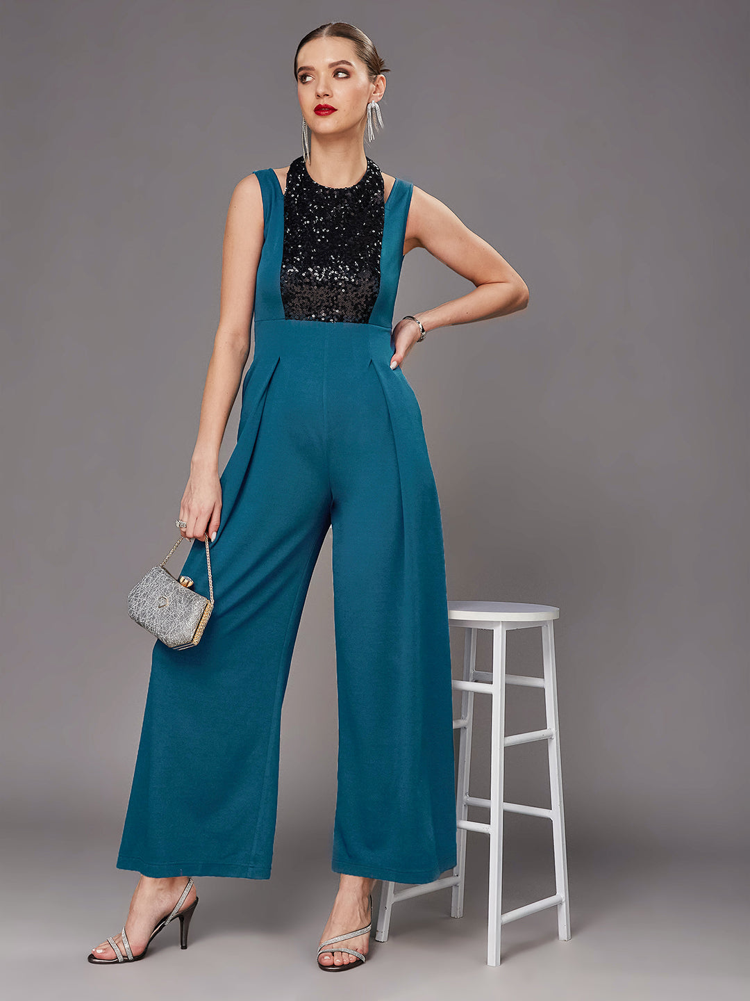 Teal Color Halter Neck Sleeveless Solid Pleated/Wide Leg Sequin Paneled Regular Length Jumpsuit for Women