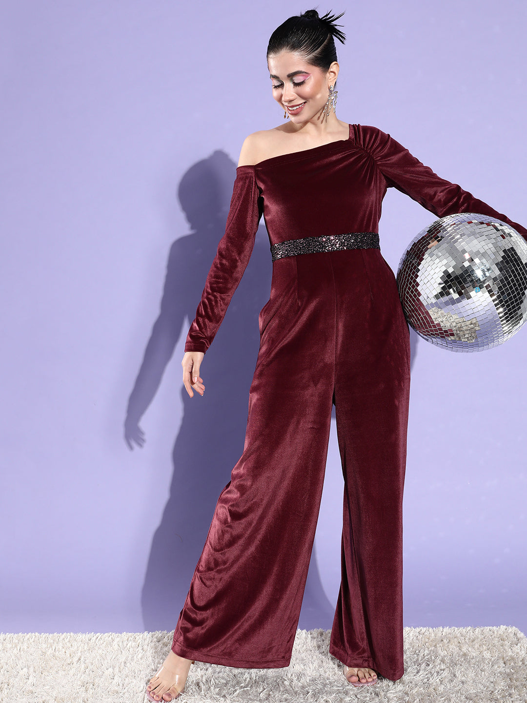 Crease Ease Women's Dark Mauve One Shoulder Full Sleeve Solid Asymmetric Regular-Length Velvet Jumpsuit