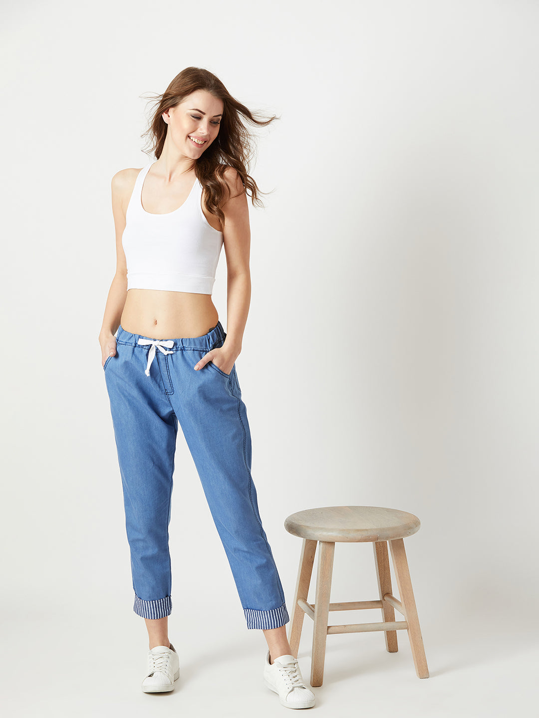 Women's Blue High Rise Clean Look Solid Cropped Striped Detailing Denim Joggers